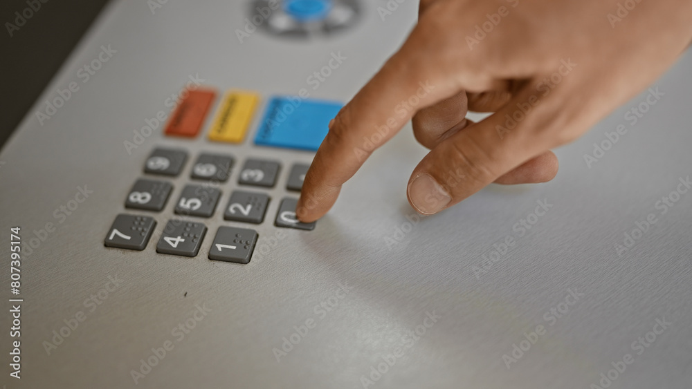 Close-up of a finger pressing a button on a pos terminal keypad during a transaction. Close-up of a finger pressing a button on a pos terminal keypad during a transaction.