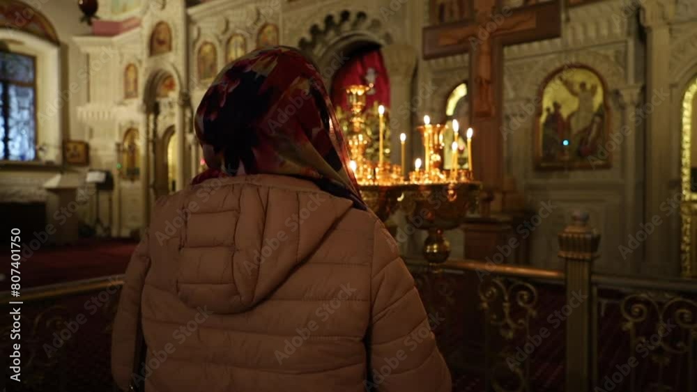 Candles in the foreground against the background of the altar Candles in the foreground against the background of the altar