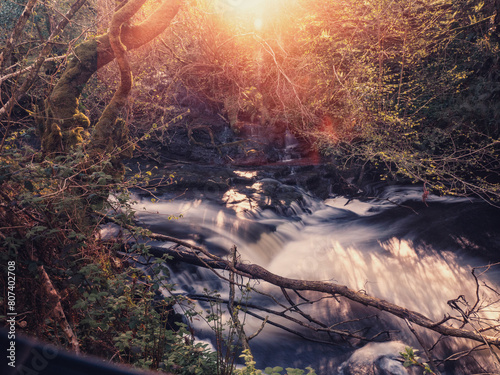 Stunning nature scene at Fowley s fall. Waterfall with blurred water. Nature background. Travel and tourism. Powerful water stream flowing in a forest.