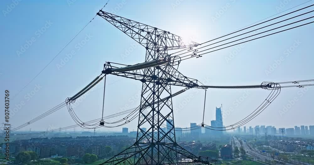 Aerial view of high voltage electricity towers on a sunny day