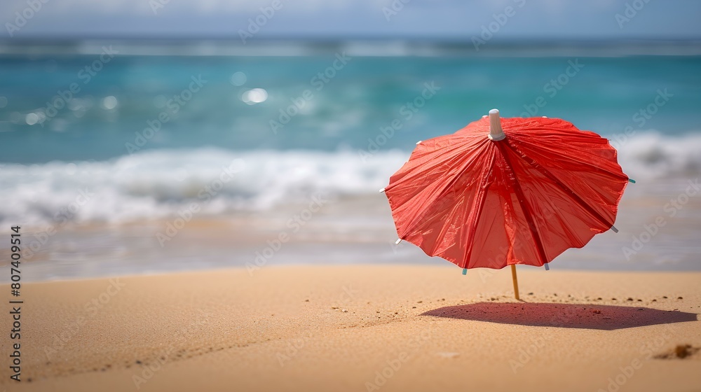 Close up of a red Cocktail Umbrella at the Beach. Beautiful Summer Vacation Background