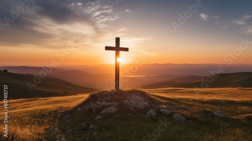 Dramatic sunset over a cross on a hill © Balaraw