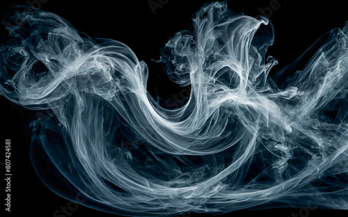 A long, blue smoke trail with a dark background photo
