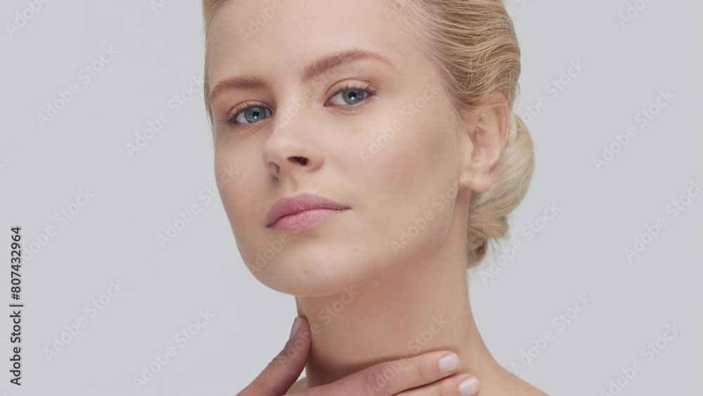 Studio portrait of young, beautiful and natural blond woman applying skin care cream. Face lifting, cosmetics and make-up concept. Studio portrait of young, beautiful and natural blond woman applying skin care cream. Face lifting, cosmetics and make-up concept.