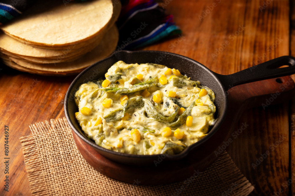 Rajas con Crema. Very popular dish in Mexico that consists of strips of poblano chili with cream, it is served as a garnish or in tacos, it is a typical recipe in Mexican Tacos de Guisado. Rajas con Crema. Very popular dish in Mexico that consists of strips of poblano chili with cream, it is served as a garnish or in tacos, it is a typical recipe in Mexican Tacos de Guisado.