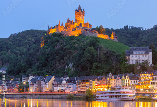 Cochem at sunset, beautiful town on romantic Moselle river, Reichsburg castle on hill, Germany photo