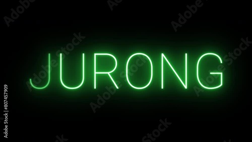 Flickering neon green glowing jurong text animated on black background photo