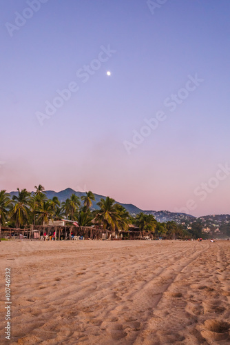 Sunset on the beach at coyuca bar in acapulco Guerrero photo