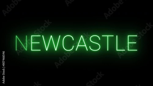 Flickering neon green glowing newcastle text animated on black background photo