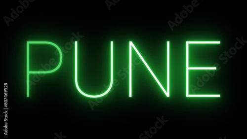 Flickering neon green glowing pune text animated on black background photo
