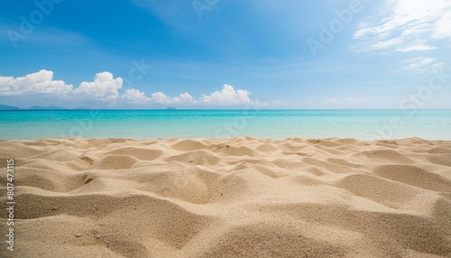 Empty sand beach in summer fresh blue sky background