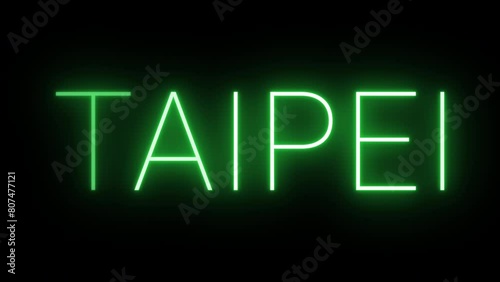 Flickering neon green glowing taipei text animated on black background photo