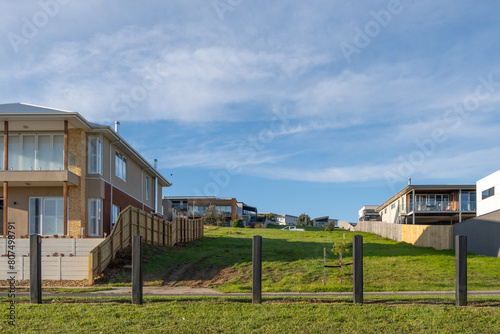 Vászonkép A vacant block of land surrounded by large and new suburban homes in a quiet residential neighbourhood