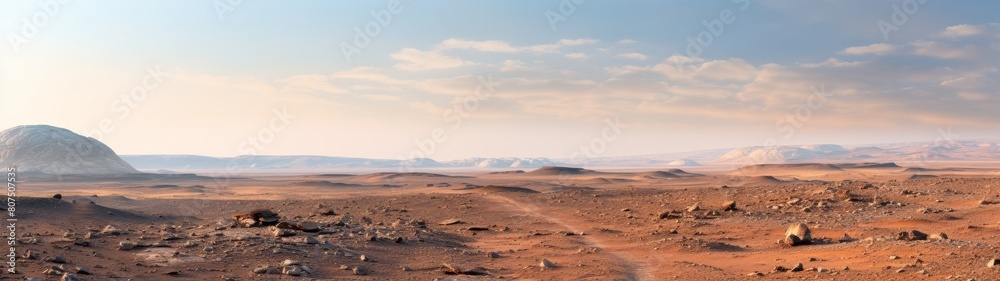 Fototapeta premium Vast desert landscape with mountains in the distance