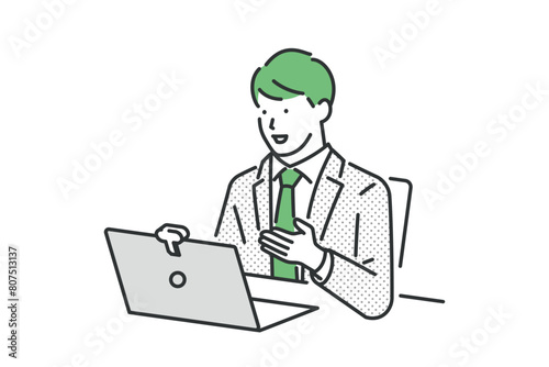 リモート会議をするスーツの男性