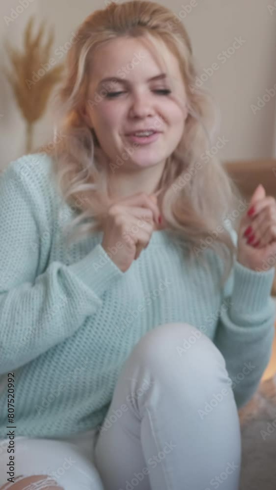 Vertical video. Music leisure. Couple chill. Good time together. Cheerful romantic man playing guitar for singing joyful woman at home in living room. Vertical video. Music leisure. Couple chill. Good time together. Cheerful romantic man playing guitar for singing joyful woman at home in living room.
