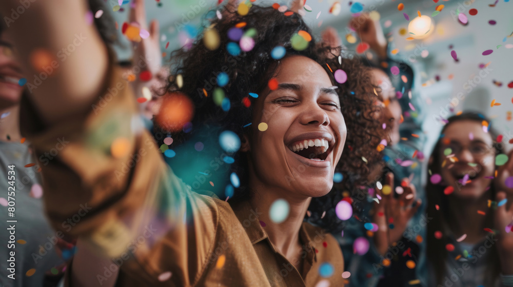 A group of people celebrating with smiles, laughter, and confetti in an office environment, embodying a spirit of success and celebration. A group of people celebrating with smiles, laughter, and confetti in an office environment, embodying a spirit of success and celebration.