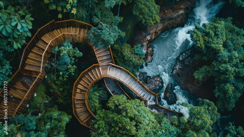 Aerial Photography of a Serene Waterfall Cascading Through a Spiral Wooden Structure