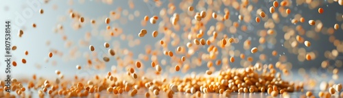 A dynamic scatter of mustard seeds captured in midair with a highspeed camera, set against a soft grey background photo