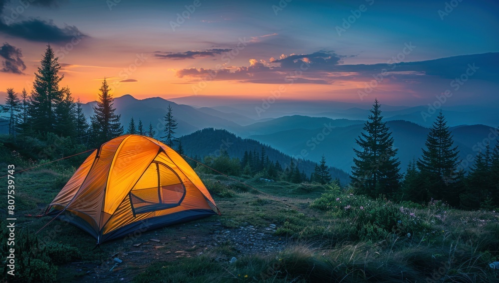 The outline of a tent against the glow of dawn, a new day beginning in the wilderness.