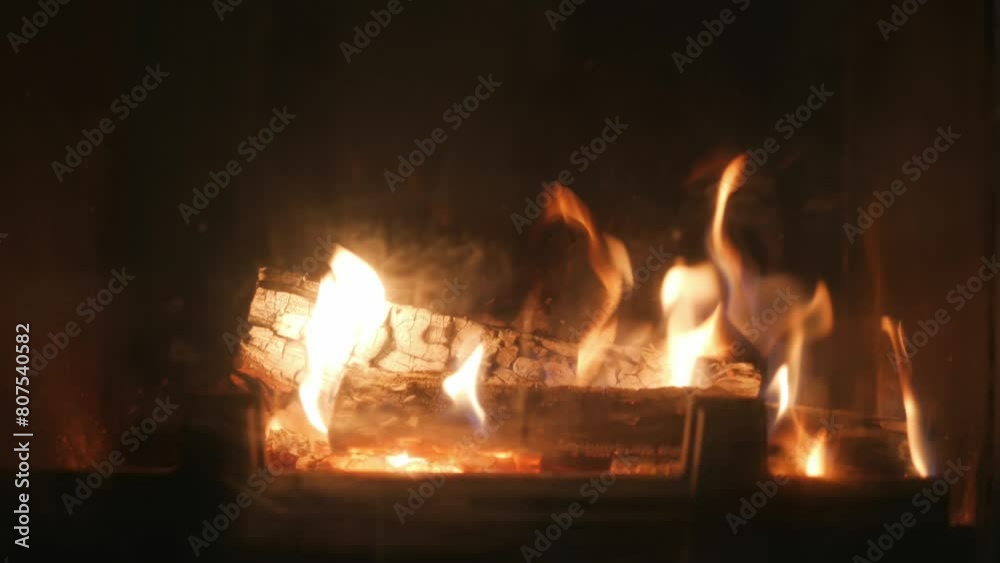Fire burns logs in fireplace, beautiful flames Fire burns logs in fireplace, beautiful flames