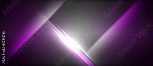 A vibrant mix of violet and magenta lights create a striking pattern against the dark backdrop, showcasing an artistic play of colors and shadows