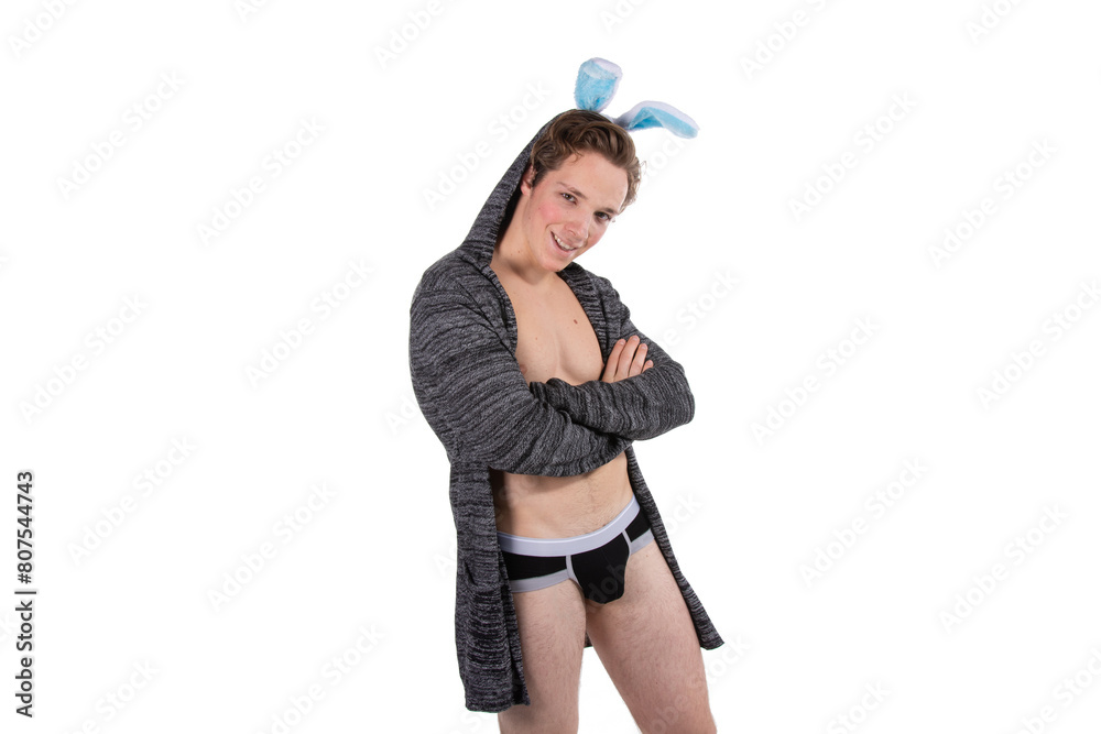 Easter evening. Handsome young man in a bunny costume posing on a white background. Easter evening. Handsome young man in a bunny costume posing on a white background.