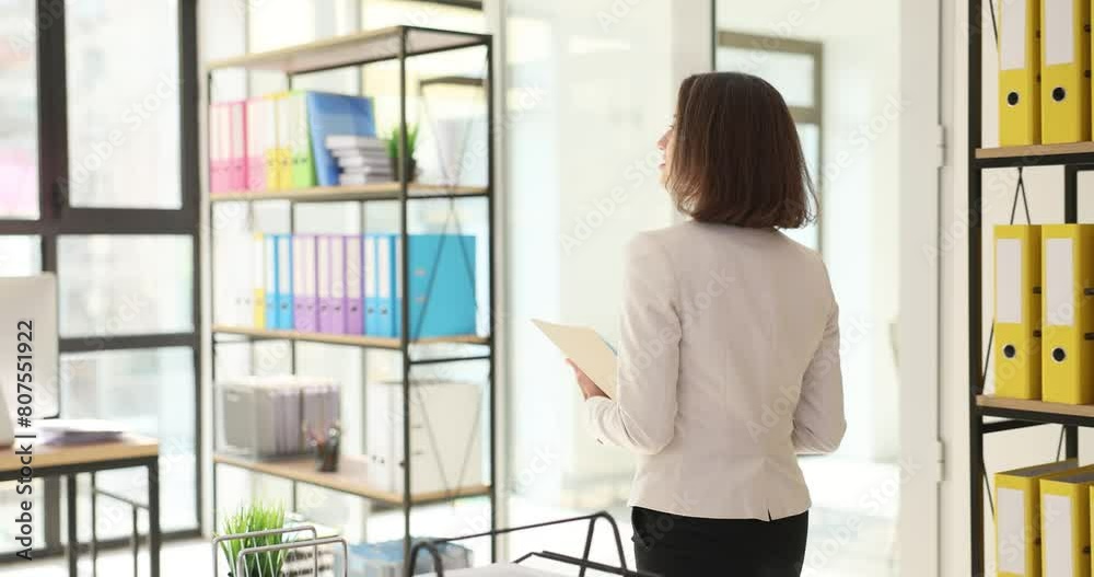 Confident businesswoman carries important documents Confident businesswoman carries important documents