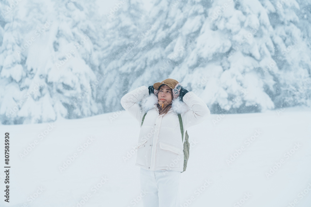 Woman tourist sightseeing Snow monster in Winter day at Mount Zao, Yamagata prefecture, Japan. Happy Traveler walking on powder snow covered in frosty weather. Travel, Adventure and Vacation Woman tourist sightseeing Snow monster in Winter day at Mount Zao, Yamagata prefecture, Japan. Happy Traveler walking on powder snow covered in frosty weather. Travel, Adventure and Vacation