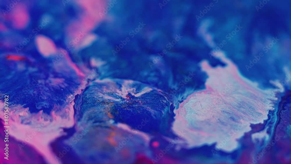 Neon fluid splash. Paint blend. Defocused pink blue color sparkling particles texture ink spill mix flow motion abstract art background. Neon fluid splash. Paint blend. Defocused pink blue color sparkling particles texture ink spill mix flow motion abstract art background.