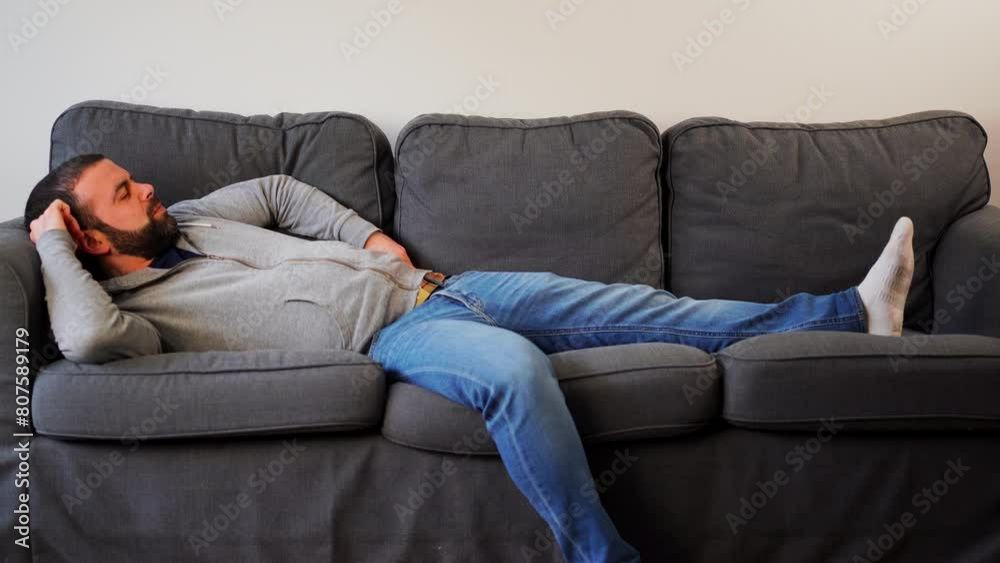 Bearded Caucasian Guy Lying Down In A Couch At Home. Static Shot Bearded Caucasian Guy Lying Down In A Couch At Home. Static Shot