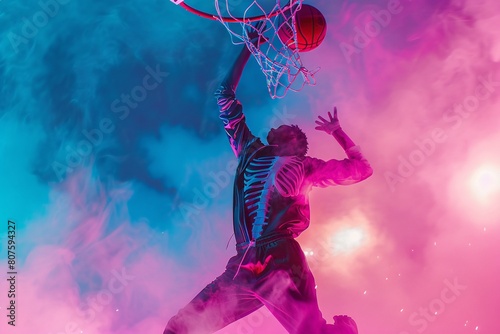 a man dunking a basketball photo