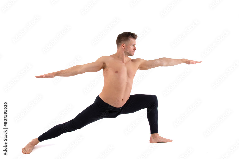 A handsome young man with an athletic body is doing fitness and yoga. White background.