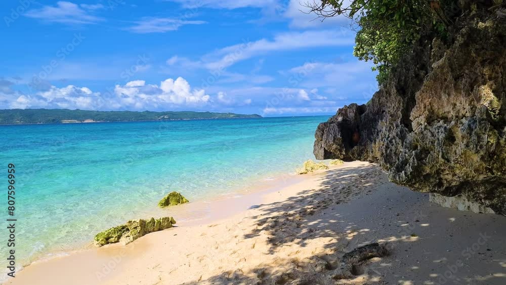 Exotic Beach With White Sand Under Rocks and Tree Shade on Tropical Island Exotic Beach With White Sand Under Rocks and Tree Shade on Tropical Island