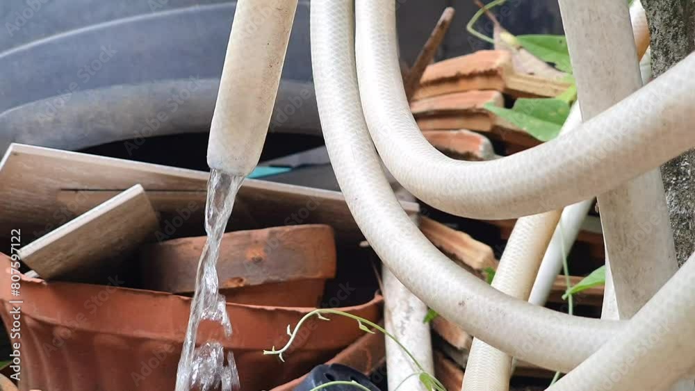 Water flowing out of the water hose Water flowing out of the water hose