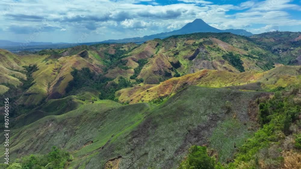 Green Landscape of Philippines with road and green plants during sunny day and beautiful sky. Large Matutum Mountain Volcano in background. Panorama view. Green Landscape of Philippines with road and green plants during sunny day and beautiful sky. Large Matutum Mountain Volcano in background. Panorama view.