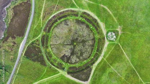 Birdseye Aerial View, Ring of Brodgar Scotland UK. Prehistoric Neolithic Landmark, Stones Arranged in Circle. High Angle Drone Shot photo