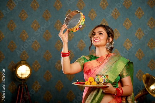 Image Of Indian Beautiful Housewife Celebrating Karva Chauth Festival 

