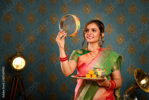 Image Of Hot Indian Wife In Traditional Indian Attire Doing Karwa Chauth Rituals 
