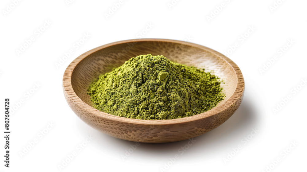 Matcha powder in a wooden plate on a white background Matcha powder in a wooden plate on a white background