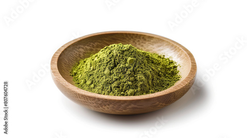 Matcha powder in a wooden plate on a white background