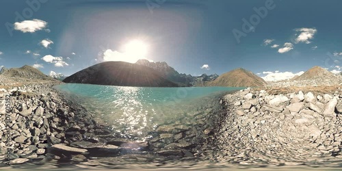 360 HD VR Gokyo Ri mountain lake at the winter season. Wild Himalayas high altitude nature and mount valley. Rocky slopes covered with ice. photo