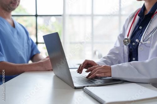 Asian female doctor Doctors are experts, knowledgeable, study, analyze and plan treatments on laptops, treatment, online chat, therapy, treatment ideas, health insurance.