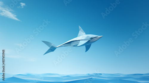 A paper cutout of a shark flying through the sky above the ocean