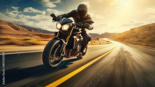 A motorcycle rider speeding along a deserted highway  