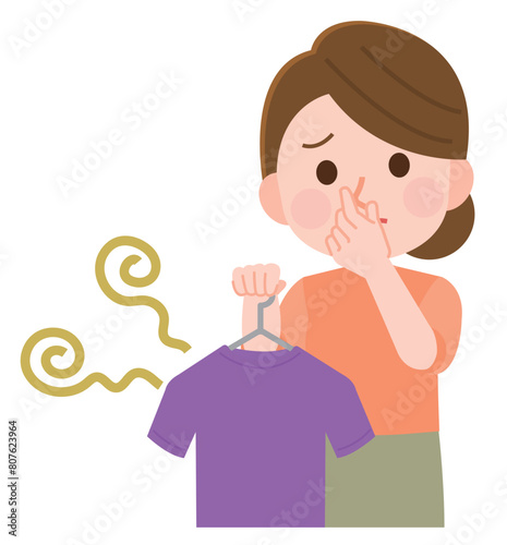 洗濯物の嫌な匂いで鼻をつまむ女性　イラスト