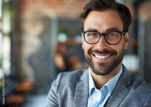 Confident Businessman with Glasses Smiling in Modern Office Environment