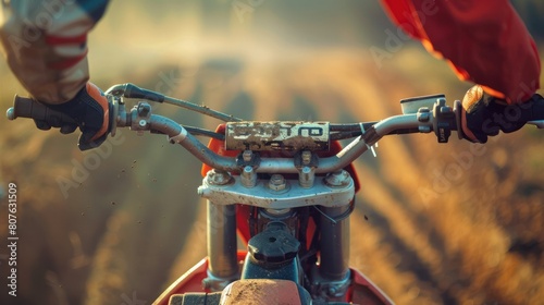  close-up shot of a motocross racer's hands gripping the handlebars, conveying the intensity of their grip and the control they exert over the bike.  