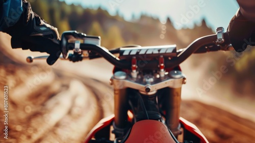  close-up shot of a motocross racer's hands gripping the handlebars, conveying the intensity of their grip and the control they exert over the bike.  