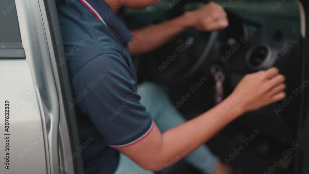 A man is opening the car door and parking the car at the station. A man is opening the car door and parking the car at the station.
